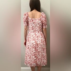 Red flower dress with a white background.